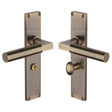 This is an image of a Heritage Brass - Bauhaus Bathroom Set Door Handle on 200mm Plate Antique Brass finish, vt6330-at that is available to order from T.H Wiggans Ironmongery in Kendal.