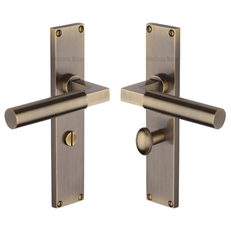 This is an image of a Heritage Brass - Bauhaus Bathroom Set Door Handle on 200mm Plate Antique Brass finish, vt6330-at that is available to order from T.H Wiggans Ironmongery in Kendal.