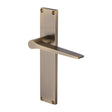 This is an image of a Heritage Brass - Gio Lever Latch Door Handle on 200mm Plate Antique Brass finish, vt8110-at that is available to order from T.H Wiggans Ironmongery in Kendal.