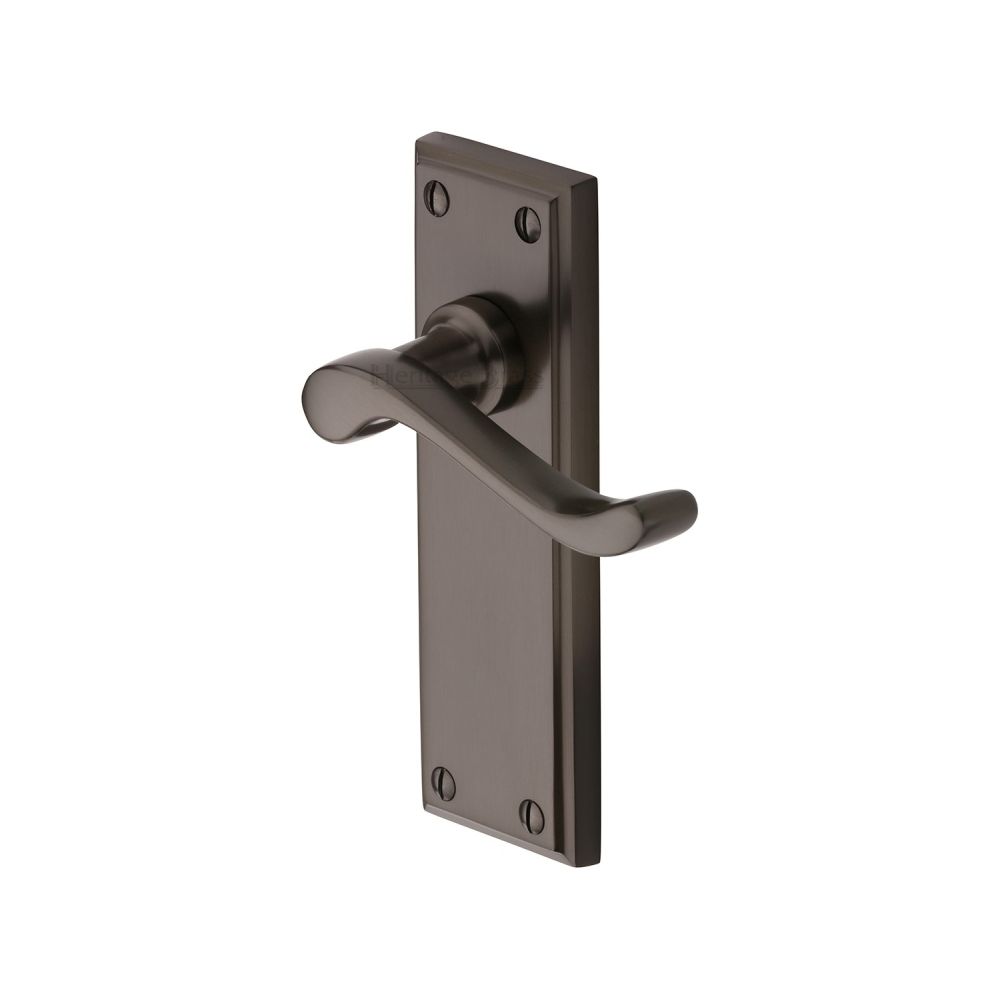 This is an image of a Heritage Brass - Door Handle Lever Latch Edwardian Design Matt Bronze Finish, w3213-mb that is available to order from T.H Wiggans Ironmongery in Kendal.
