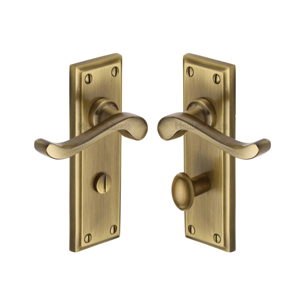 This is an image of a Heritage Brass - Door Handle for Bathroom Edwardian Design Antique Brass Finish, w3220-at that is available to order from T.H Wiggans Ironmongery in Kendal.