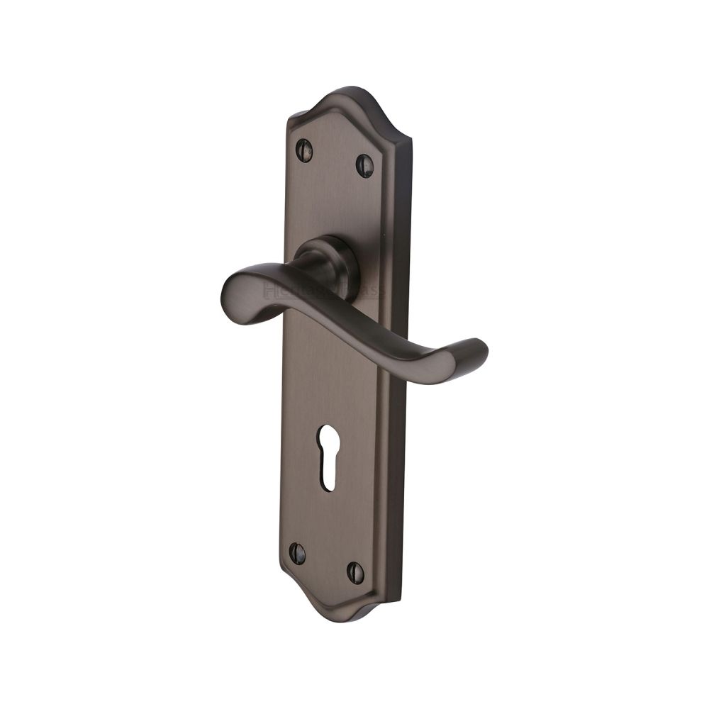 This is an image of a Heritage Brass - Door Handle Lever Lock Buckingham Design Matt Bronze Finish, w4200-mb that is available to order from T.H Wiggans Ironmongery in Kendal.