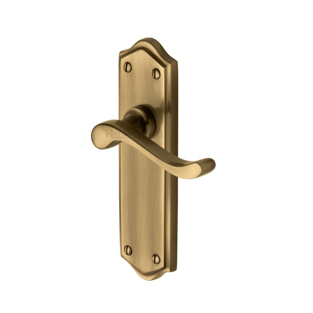 This is an image of a Heritage Brass - Door Handle Lever Latch Buckingham Design Antique Brass Finish, w4210-at that is available to order from T.H Wiggans Ironmongery in Kendal.