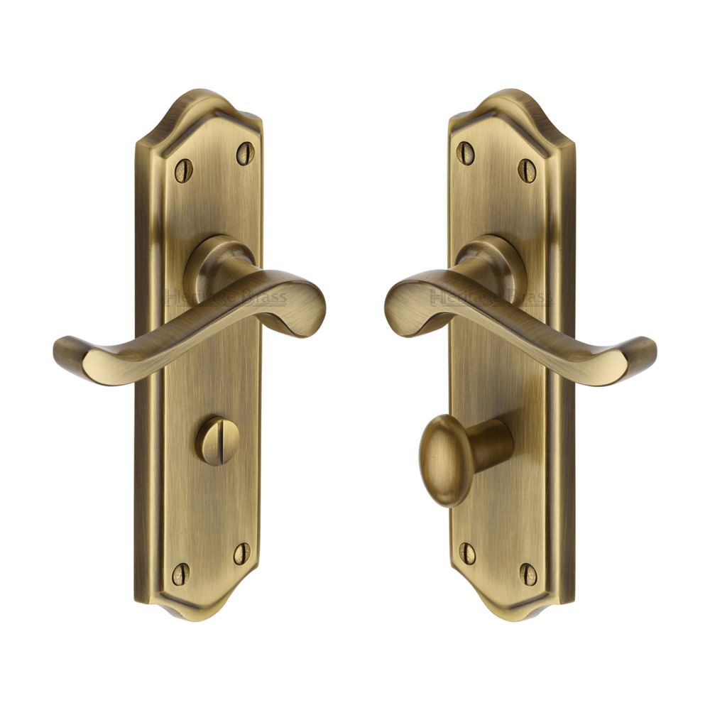 This is an image of a Heritage Brass - Door Handle for Bathroom Buckingham Design Antique Brass Finish, w4220-at that is available to order from T.H Wiggans Ironmongery in Kendal.
