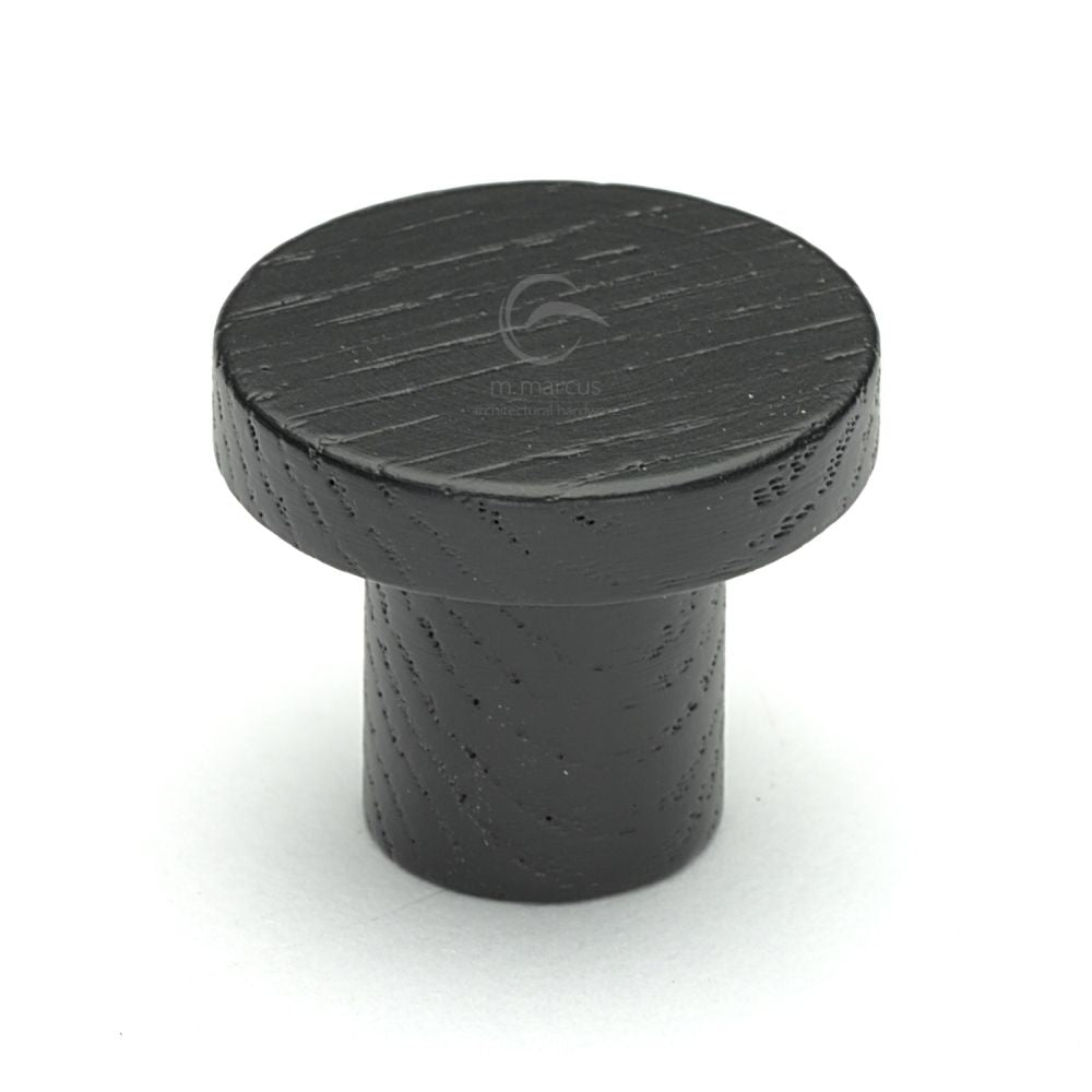 This is an image of a M.Marcus - Wooden Cabinet Knob Round Circum Design 33mm Black Ash Finish, w4470-33-ash that is available to order from T.H Wiggans Ironmongery in Kendal.