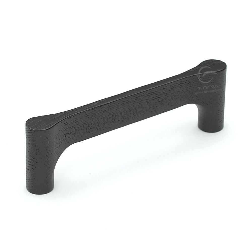 This is an image of a M.Marcus - Wooden Cabinet Pull Handle Gio Design 128mm Black Ash Finish, w7827-128-ash that is available to order from T.H Wiggans Ironmongery in Kendal.