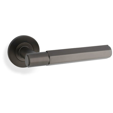 This is an image showing Alexander & Wilks - Spitfire Hex Lever on Round Rose - Dark Bronze aw224dbz available to order from T.H. Wiggans Ironmongery in Kendal, quick delivery and discounted prices.