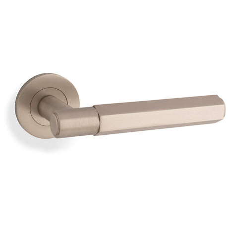 This is an image showing Alexander & Wilks - Spitfire Hex Lever on Round Rose - Satin Nickel aw224sn available to order from T.H. Wiggans Ironmongery in Kendal, quick delivery and discounted prices.