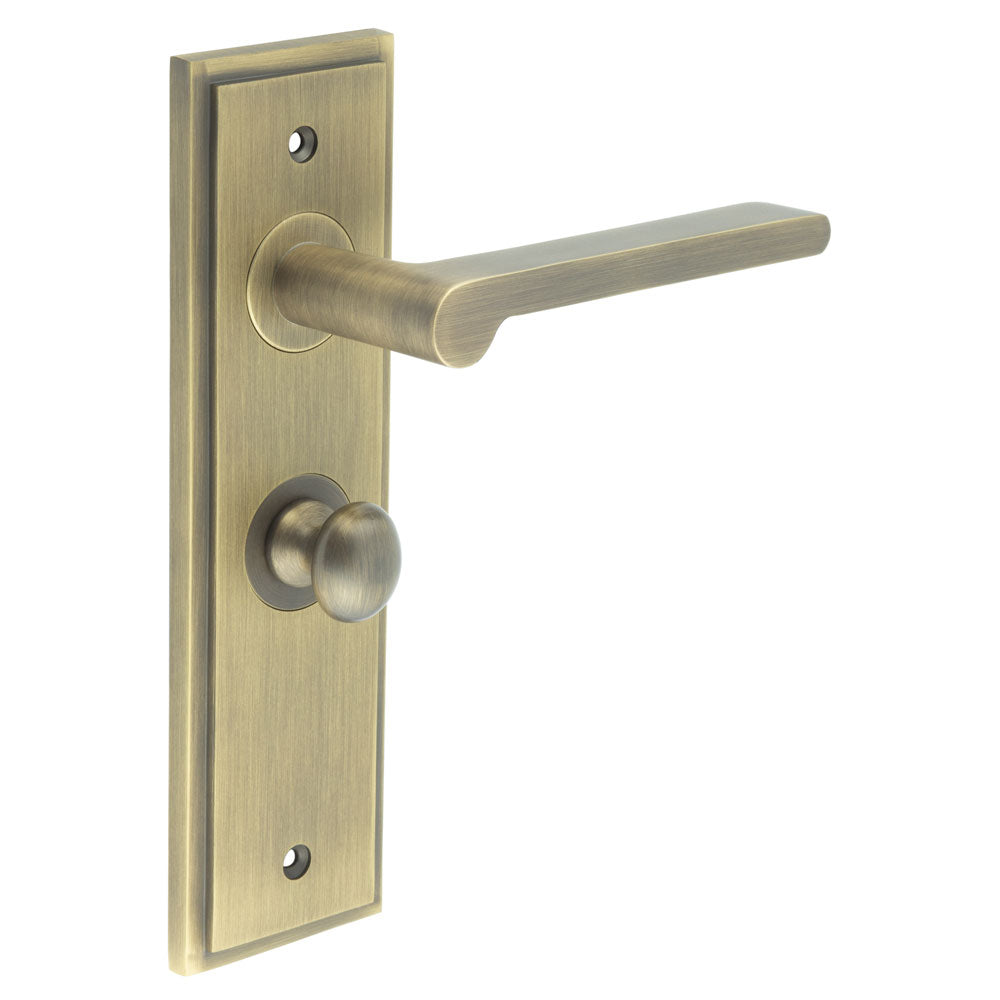 This is an image showing the Frelan - Fitzrovia Door Handle Bathroom Backplate Antique Brass & Turn & Release available to order from T.H. Wiggans Ironmongery in Kendal