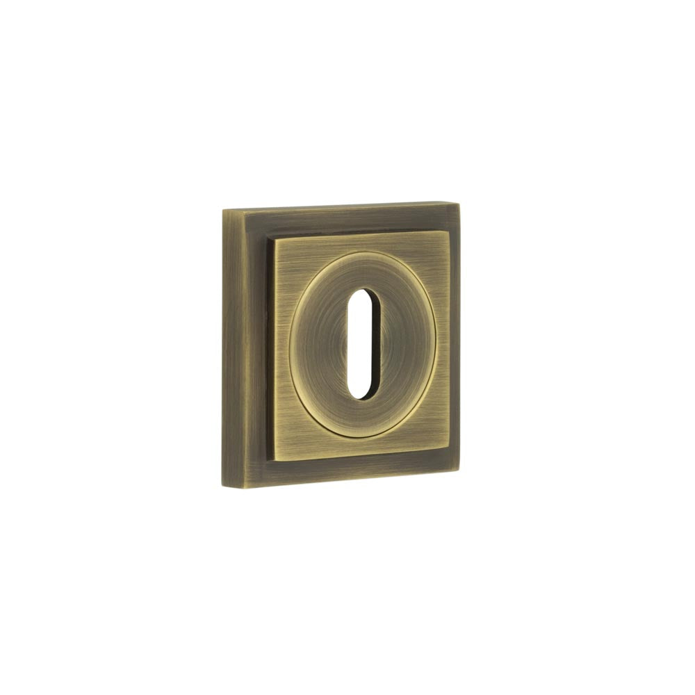 This is an image showing the Frelan - Burlington Standard Keyway Escutcheons Square Stepped Rose Antique Brass available to order from T.H. Wiggans Ironmongery in Kendal