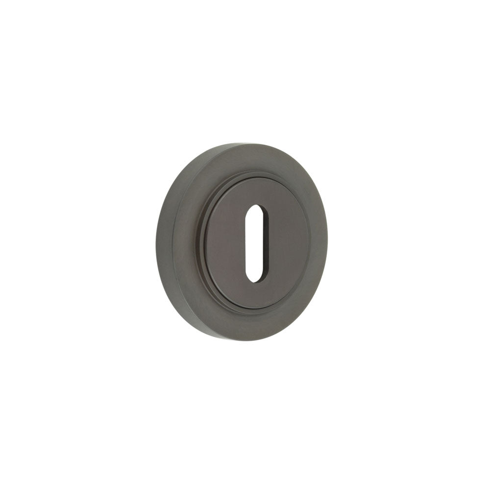 This is an image showing the Frelan - Burlington Standard Keyway Escutcheons Plain Rose Dark Bronze available to order from T.H. Wiggans Ironmongery in Kendal