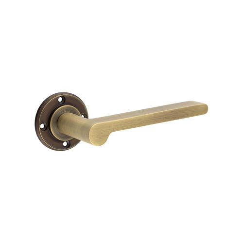 This is an image showing the Burlington - Fitzrovia Lever on Rose Door Handle - Roses Sold Separately available to order from T.H. Wiggans Ironmongery in Kendal
