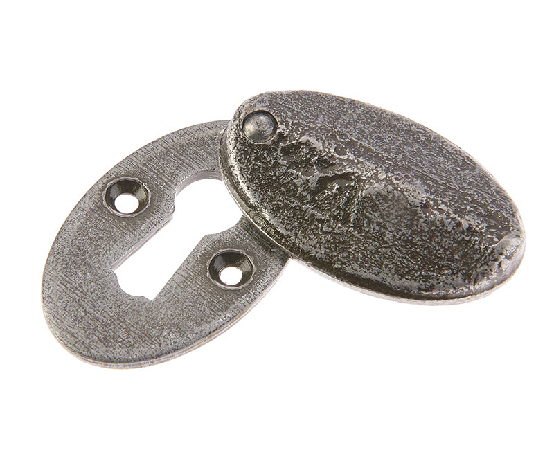 This is an image showing the Frelan - Valley Forge Oval Covered Standard Key Escutcheon - Pewter available to order from T.H. Wiggans Ironmongery in Kendal