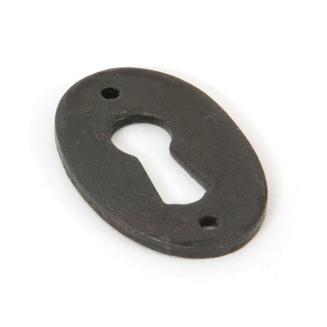 This is an image of From The Anvil - Beeswax Oval Escutcheon available to order from T.H Wiggans Architectural Ironmongery in Kendal, quick delivery and discounted prices.
