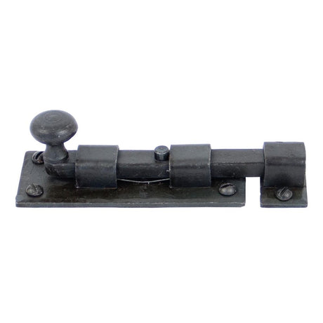 This is an image showing From The Anvil - Beeswax 4" Straight Knob Bolt available from T.H Wiggans Architectural Ironmongery in Kendal, quick delivery and discounted prices