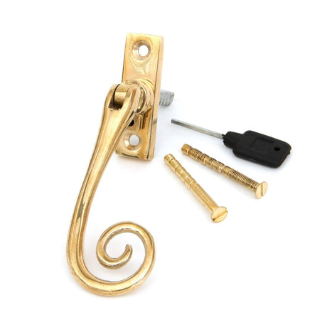This is an image showing From The Anvil - Polished Brass Slim Monkeytail Espag - RH available from T.H Wiggans Architectural Ironmongery in Kendal, quick delivery and discounted prices
