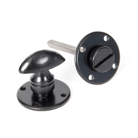 This is an image of From The Anvil - Black Round Bathroom Thumbturn available to order from T.H Wiggans Architectural Ironmongery in Kendal, quick delivery and discounted prices.