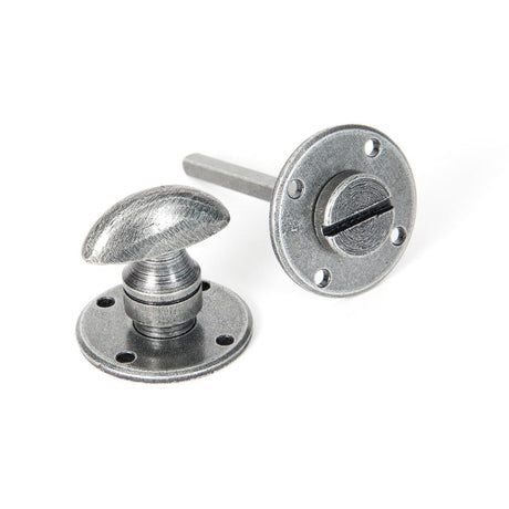 This is an image of From The Anvil - Pewter Round Bathroom Thumbturn available to order from T.H Wiggans Architectural Ironmongery in Kendal, quick delivery and discounted prices.