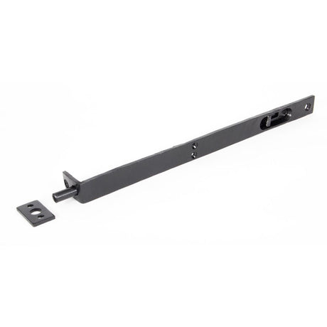 This is an image showing From The Anvil - Black 12" Flush/Slide Door Bolt available from trade door handles, quick delivery and discounted prices
