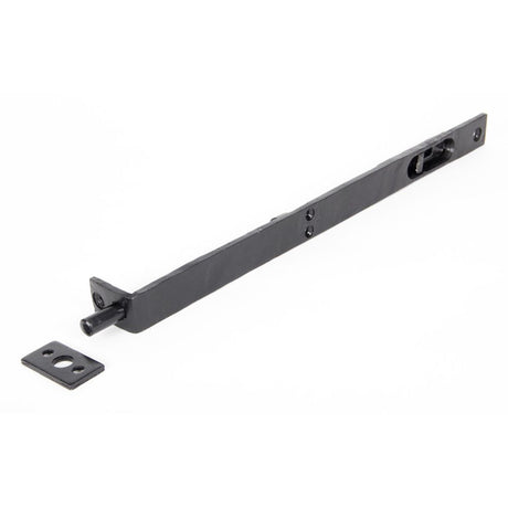 This is an image showing From The Anvil - Black 12" Flush/Slide Door Bolt available from T.H Wiggans Architectural Ironmongery in Kendal, quick delivery and discounted prices