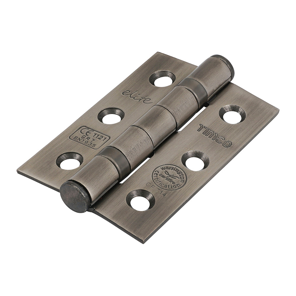 This is an image showing TIMCO Grade 7 Fire Door Hinges - Antique Brass - 76 x 50 x 2.0 - 2 Pieces Box available from T.H Wiggans Ironmongery in Kendal, quick delivery at discounted prices.