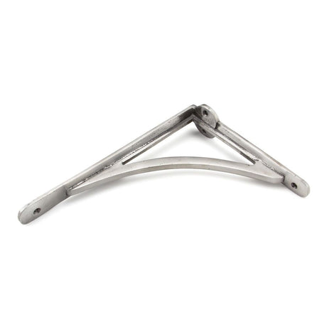 This is an image showing From The Anvil - Natural Smooth 10'' x 7'' Curved Shelf Bracket available from T.H Wiggans Architectural Ironmongery in Kendal, quick delivery and discounted prices