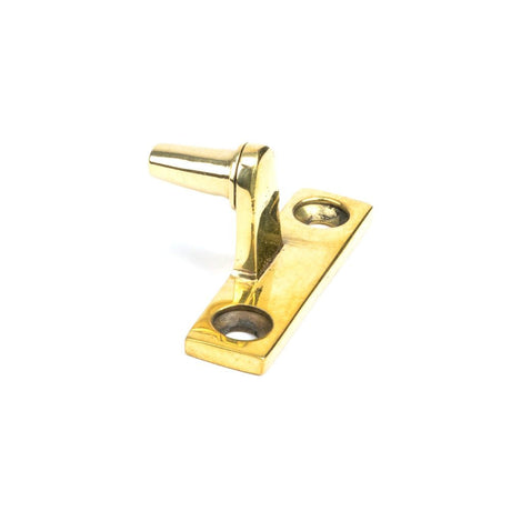 This is an image showing From The Anvil - Aged Brass Cranked Casement Stay Pin available from T.H Wiggans Architectural Ironmongery in Kendal, quick delivery and discounted prices