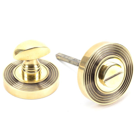 This is an image of From The Anvil - Aged Brass Round Thumbturn Set (Beehive) available to order from T.H Wiggans Architectural Ironmongery in Kendal, quick delivery and discounted prices.