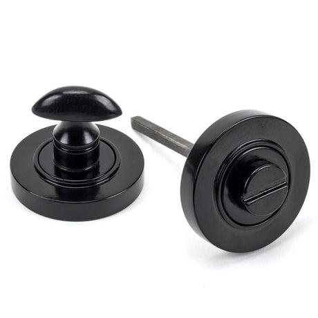 This is an image of From The Anvil - Black Round Thumbturn Set (Plain) available to order from T.H Wiggans Architectural Ironmongery in Kendal, quick delivery and discounted prices.