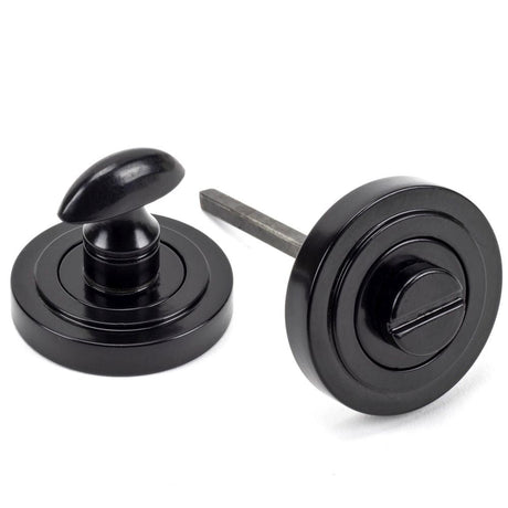 This is an image of From The Anvil - Black Round Thumbturn Set (Art Deco) available to order from T.H Wiggans Architectural Ironmongery in Kendal, quick delivery and discounted prices.