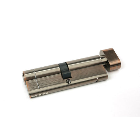 This is an image showing From The Anvil - Polished Bronze 45/45 5pin Euro Cylinder/Thumbturn available from T.H Wiggans Architectural Ironmongery in Kendal, quick delivery and discounted prices