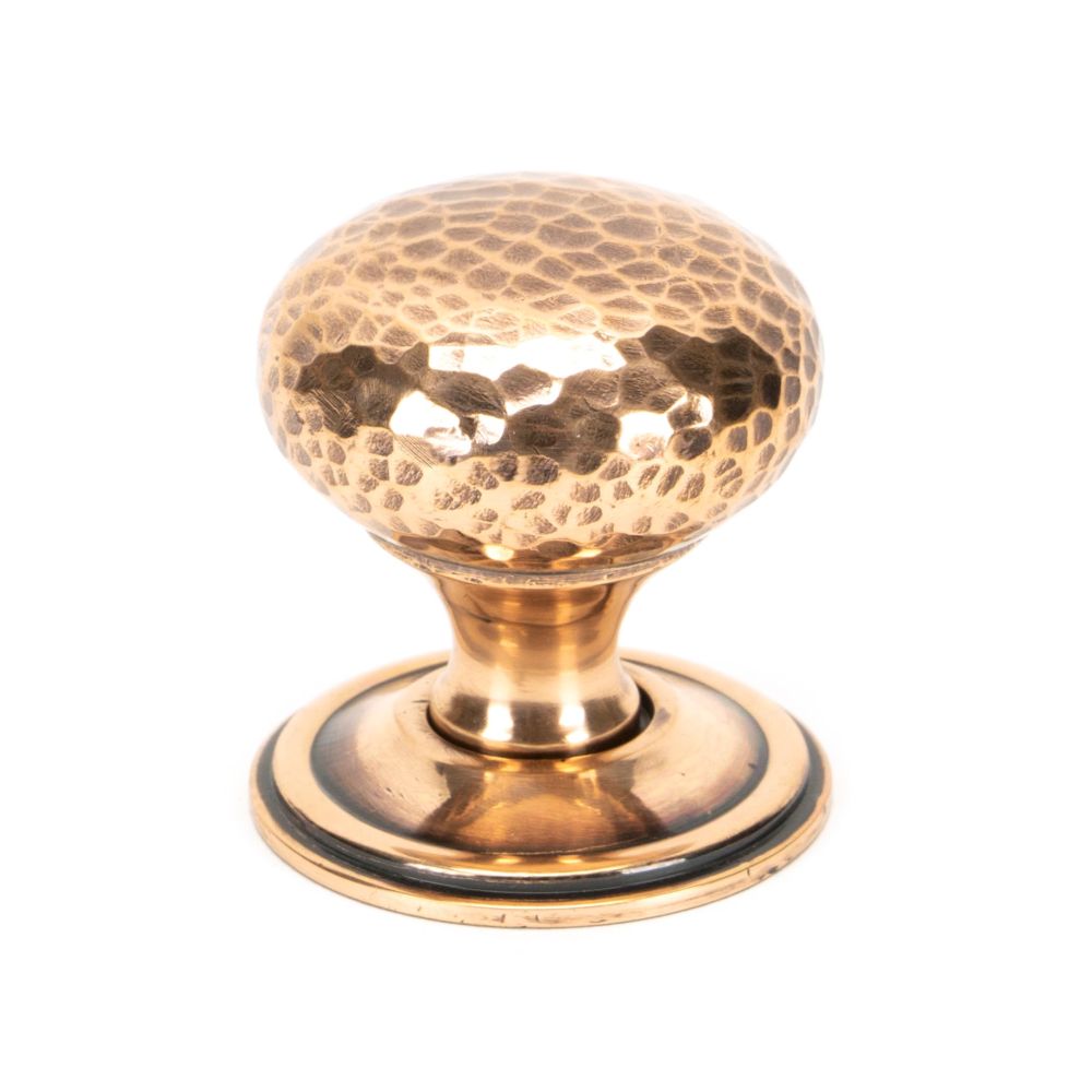 This is an image showing From The Anvil - Polished Bronze Hammered Mushroom Cabinet Knob 38mm available from T.H Wiggans Architectural Ironmongery in Kendal, quick delivery and discounted prices