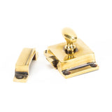 This is an image showing From The Anvil - Aged Brass Cabinet Latch available from trade door handles, quick delivery and discounted prices