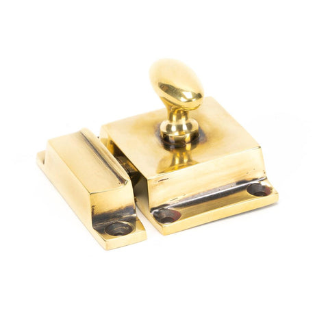 This is an image showing From The Anvil - Aged Brass Cabinet Latch available from T.H Wiggans Architectural Ironmongery in Kendal, quick delivery and discounted prices