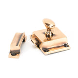 This is an image showing From The Anvil - Polished Bronze Cabinet Latch available from trade door handles, quick delivery and discounted prices