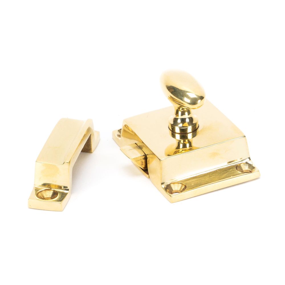 This is an image showing From The Anvil - Polished Brass Cabinet Latch available from trade door handles, quick delivery and discounted prices