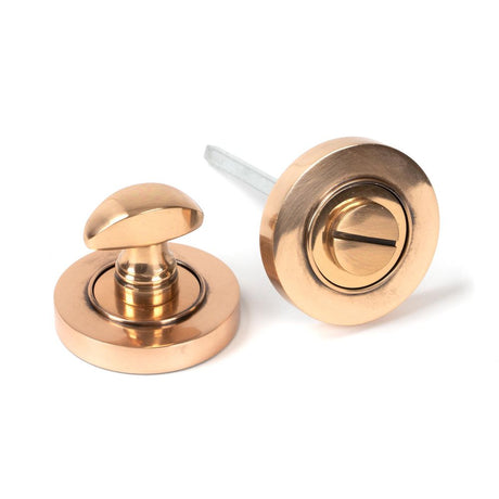 This is an image of From The Anvil - Polished Bronze Round Thumbturn Set (Plain) available to order from T.H Wiggans Architectural Ironmongery in Kendal, quick delivery and discounted prices.