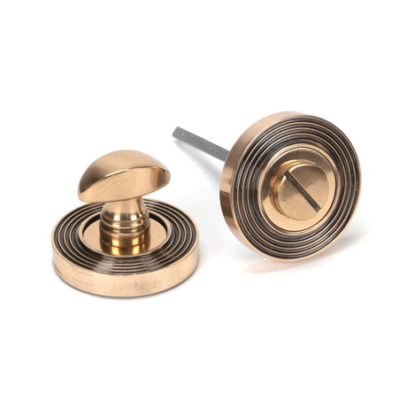 This is an image of From The Anvil - Polished Bronze Round Thumbturn Set (Beehive) available to order from T.H Wiggans Architectural Ironmongery in Kendal, quick delivery and discounted prices.
