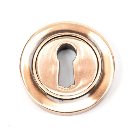This is an image of From The Anvil - Polished Bronze Round Escutcheon (Plain) available to order from T.H Wiggans Architectural Ironmongery in Kendal, quick delivery and discounted prices.