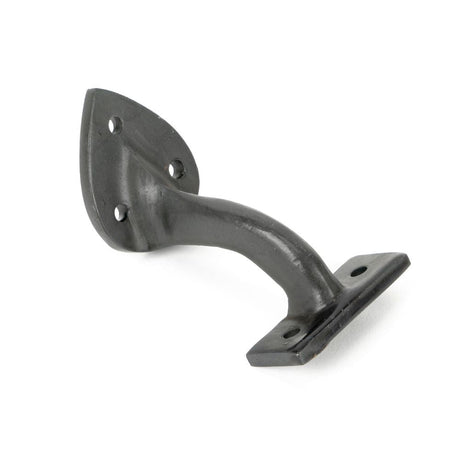 This is an image showing From The Anvil - Beeswax 2" Handrail Bracket available from T.H Wiggans Architectural Ironmongery in Kendal, quick delivery and discounted prices