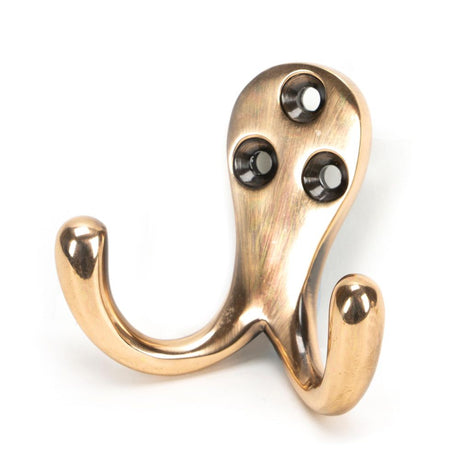 This is an image showing From The Anvil - Polished Bronze Celtic Double Robe Hook available from T.H Wiggans Architectural Ironmongery in Kendal, quick delivery and discounted prices