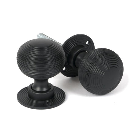This is an image of From The Anvil - Matt Black Heavy Beehive Mortice/Rim Knob Set available to order from T.H Wiggans Architectural Ironmongery in Kendal, quick delivery and discounted prices.