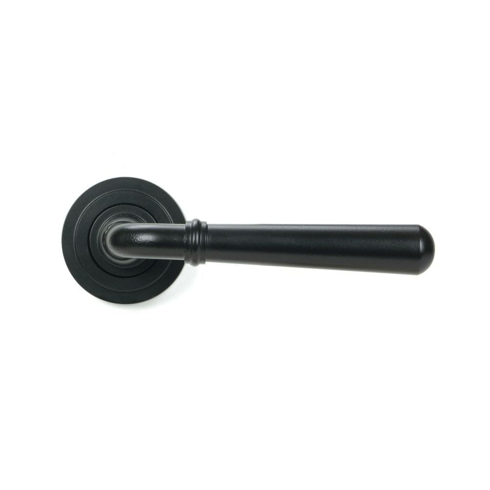 This is an image showing From The Anvil - Matt Black Newbury Lever on Rose Set (Art Deco) available from trade door handles, quick delivery and discounted prices