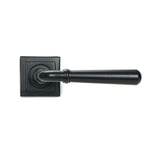 This is an image showing From The Anvil - Matt Black Newbury Lever on Rose Set (Square) available from trade door handles, quick delivery and discounted prices