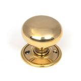 This is an image showing From The Anvil - Aged Brass Mushroom Mortice/Rim Knob Set available from trade door handles, quick delivery and discounted prices