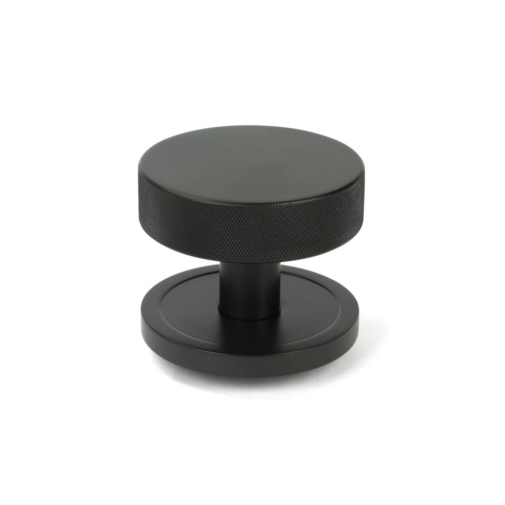 This is an image of From The Anvil - Aged Bronze Brompton Centre Door Knob (Plain) available to order from T.H Wiggans Architectural Ironmongery in Kendal, quick delivery and discounted prices.