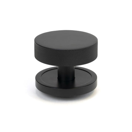 This is an image of From The Anvil - Matt Black Brompton Centre Door Knob (Plain) available to order from T.H Wiggans Architectural Ironmongery in Kendal, quick delivery and discounted prices.