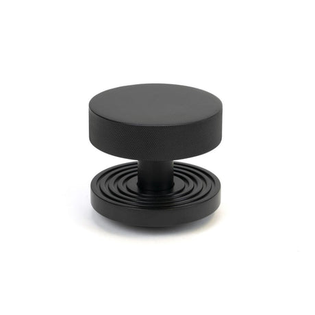 This is an image of From The Anvil - Matt Black Brompton Centre Door Knob (Beehive) available to order from T.H Wiggans Architectural Ironmongery in Kendal, quick delivery and discounted prices.