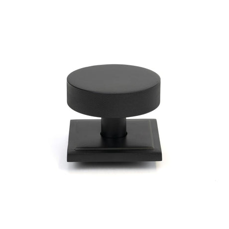 This is an image of From The Anvil - Matt Black Brompton Centre Door Knob (Square) available to order from T.H Wiggans Architectural Ironmongery in Kendal, quick delivery and discounted prices.