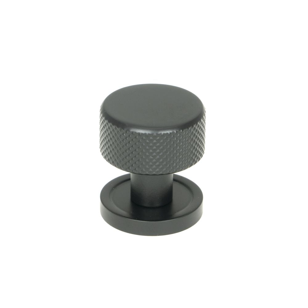 This is an image showing From The Anvil - Matt Black Brompton Cabinet Knob - 25mm (Plain) available from T.H Wiggans Architectural Ironmongery in Kendal, quick delivery and discounted prices